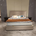 Panel-Stitched Leather Bed with Top Strap Details and High-Gloss Wooden Sides